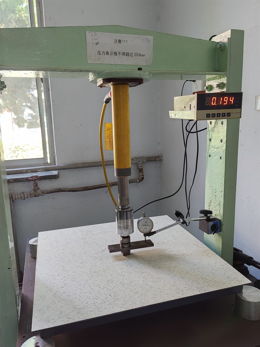 Concentrated load testing of a raised floor panel